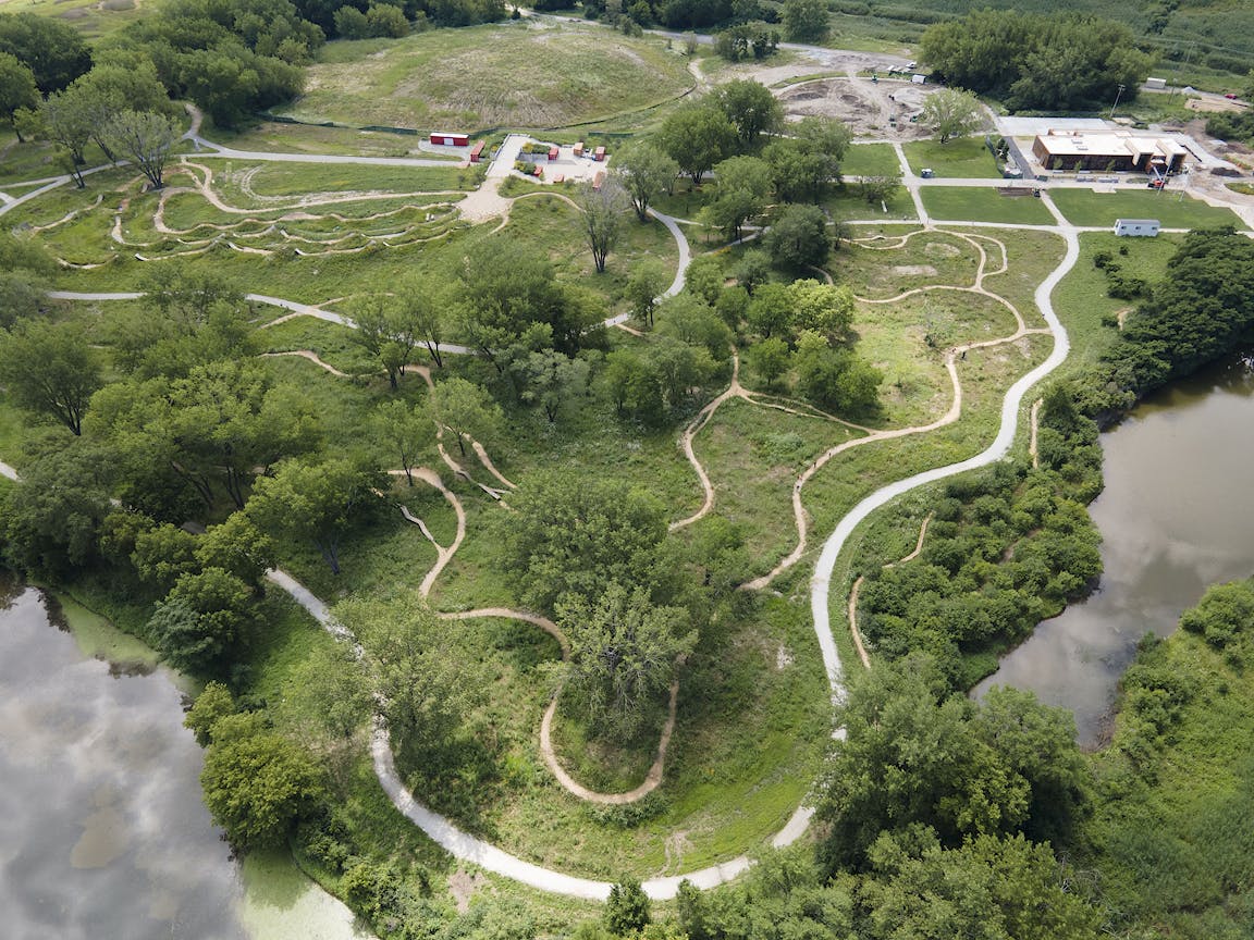 An aerial view of a park with twisting paths.